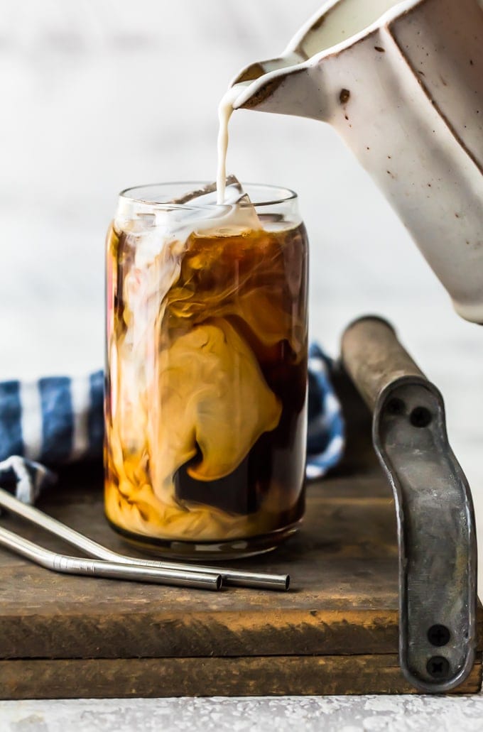 coffee with creamer being poured in