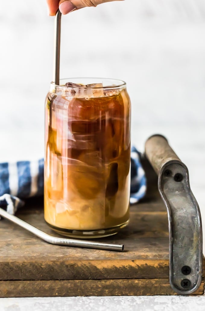 iced coffee being stirred with a straw