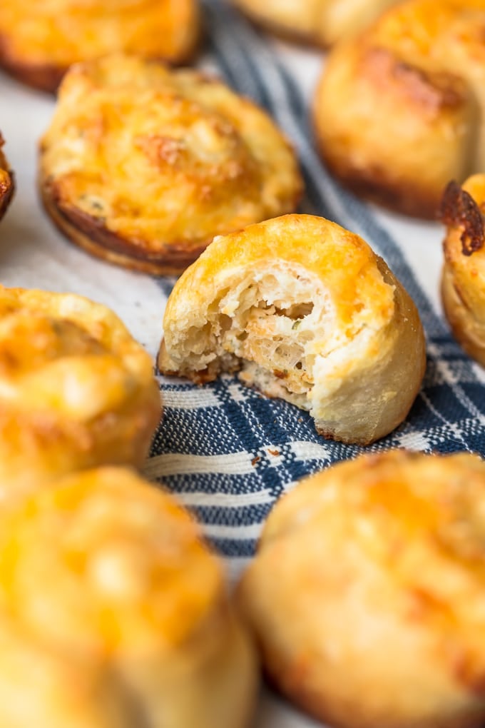 Garlic Cheese Bread Rolls lined up, one with a bite taken out of it