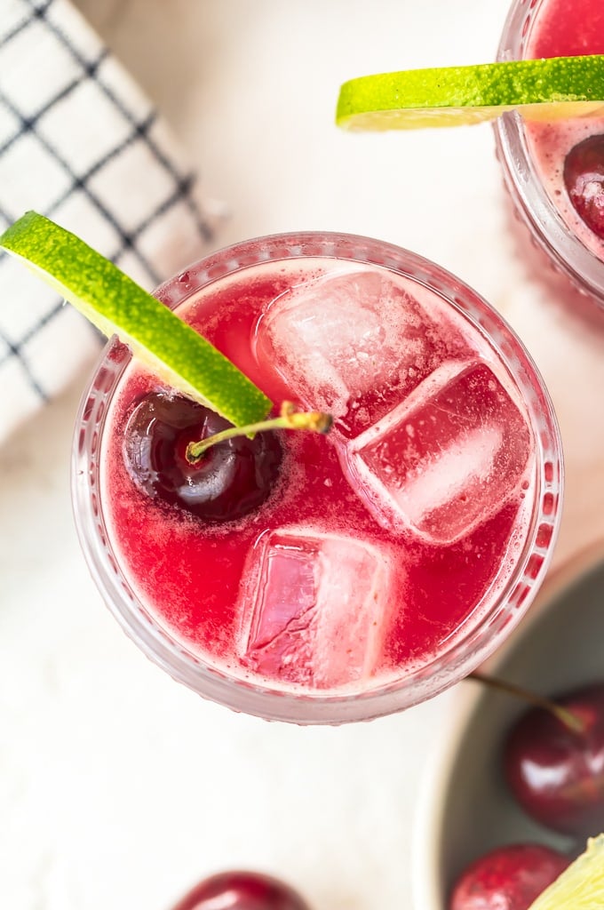 This homemade cherry limeade recipe is filled with fresh cherries & limes. One of the most refreshing summer drinks, with or without alcohol!