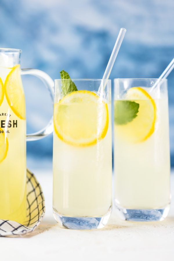 glasses of lemonade against a blue background