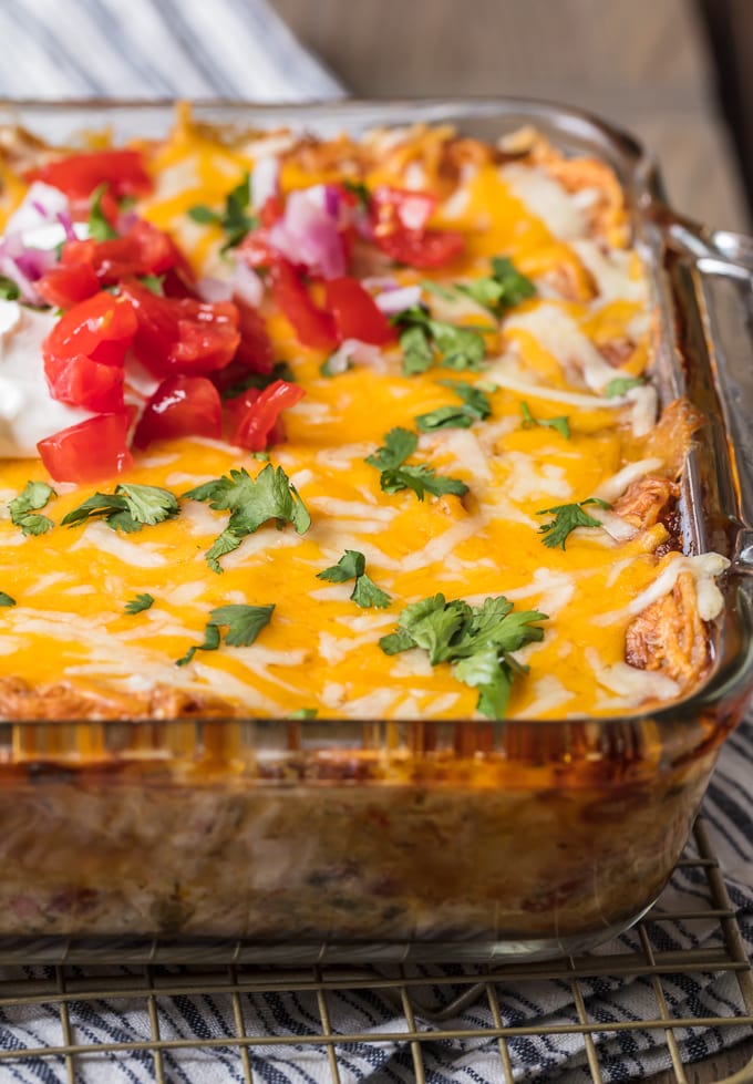 Casserole dish filled with chicken, cheese, green chiles, tomatoes, peppers, onions, and more