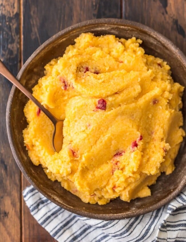 Cheese Grits are a classic Southern staple perfect for a quick breakfast, snack, or side dish. I combined them with another staple to create this delicious Pimento Cheese Grits recipe! They're cheesy, creamy, and oh so tasty. Eat them on their own on pair them with pork or chicken. You're going to love these easy cheese grits!