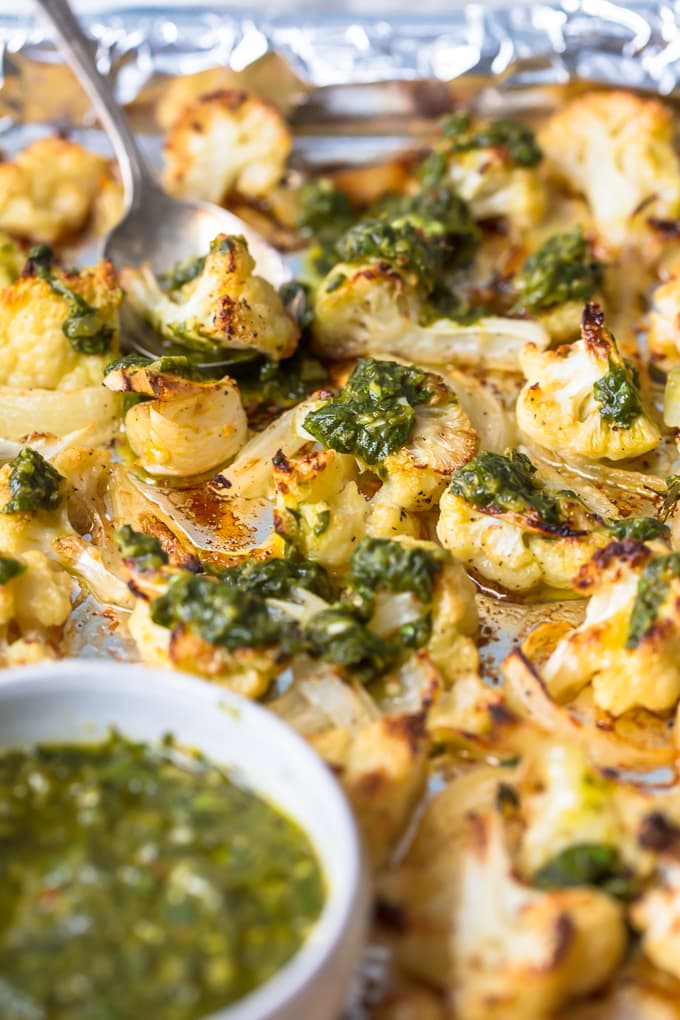 Cauliflower drizzled with green chimichurri sauce