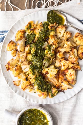 Roasted Cauliflower is a healthy and versatile side dish perfect for any meal. This cauliflower side dish with chimichurri sauce is so crispy and flavorful!