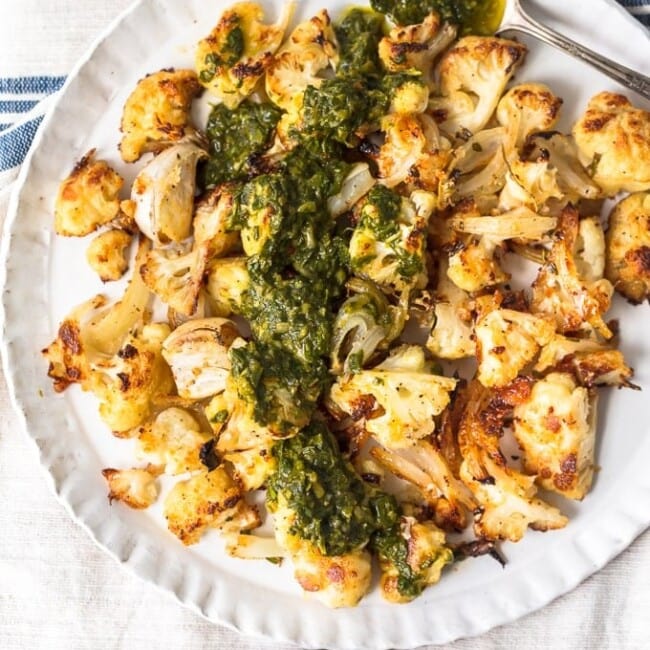 Roasted Cauliflower is a healthy and versatile side dish perfect for any meal. This cauliflower side dish with chimichurri sauce is so crispy and flavorful!