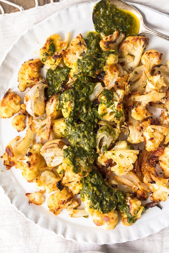 roasted cauliflower covered in chimichurri sauce