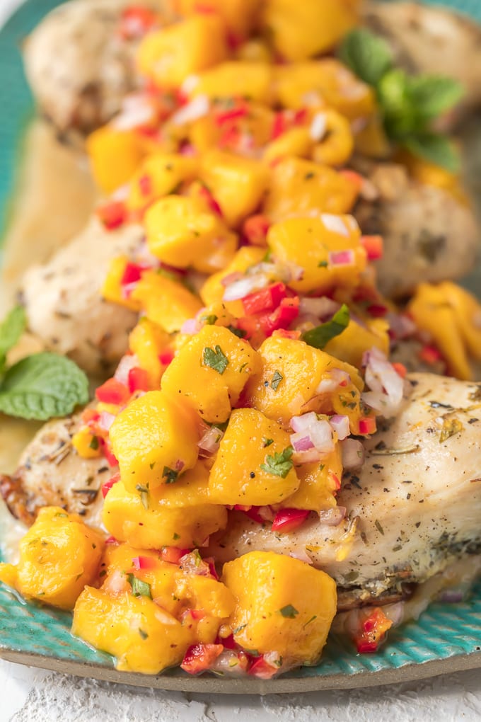 Chicken topped with mango salsa