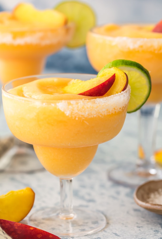 skinny frozen peach margaritas in glasses