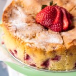 strawberry buttermilk cake on a cake plate