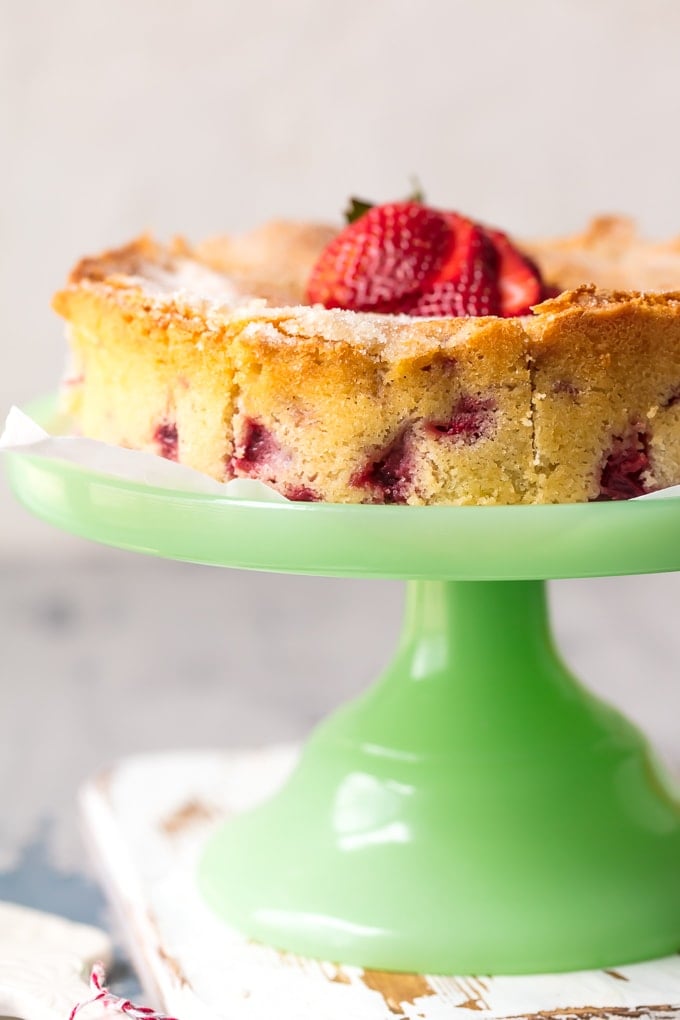 strawberry buttermilk cake on a cakestand