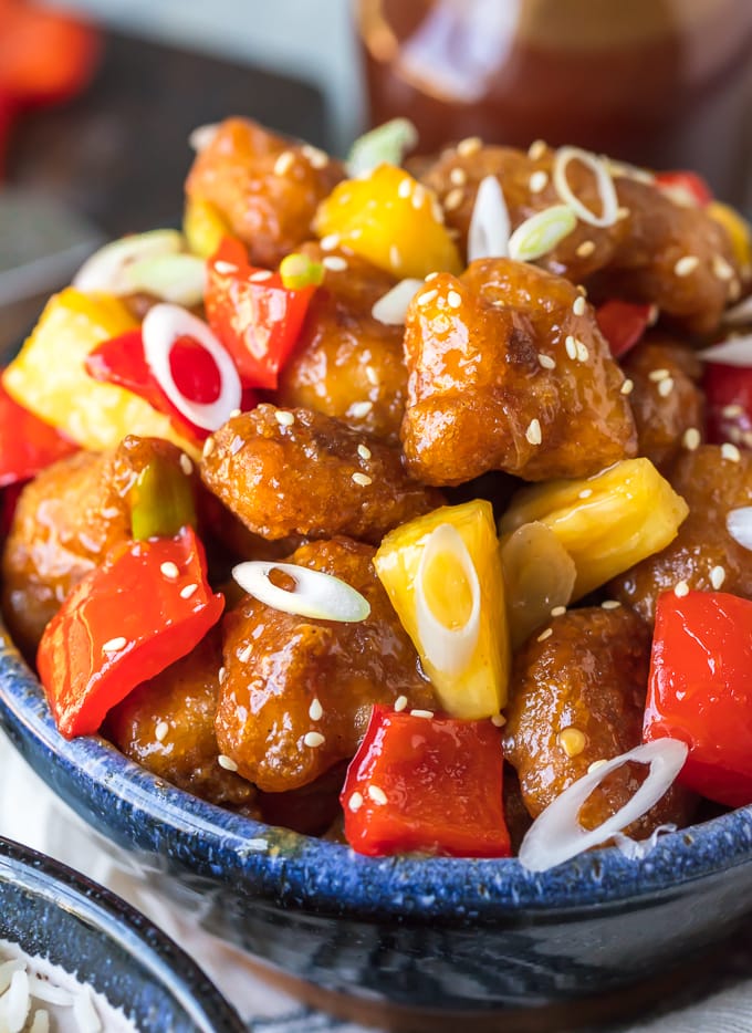 Sweet and sour chicken mixed with pineapple, scallions, and bell pepers