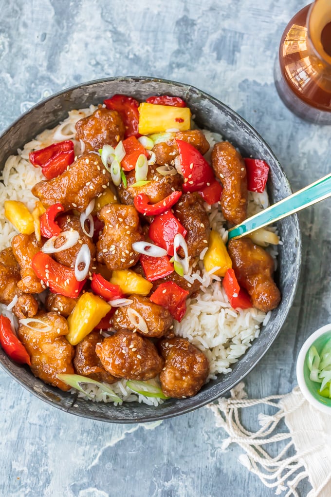 sweet and sour chicken mix in a bowl of white rice