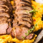 sliced sweet tea pork tenderloin on a plate