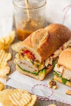 This Sub Sandwich recipe is filled with so many delicious things! In addition to the juicy teriyaki chicken breast and homemade teriyaki dressing, there's a tasty cobb salad inspired mix on top. This teriyaki chicken sandwich is a mix of a lot of different things, but it all comes together so perfectly and the flavors are so well mixed. I love this cobb salad & chicken sandwich! Try it out if you're looking for something a little different.
