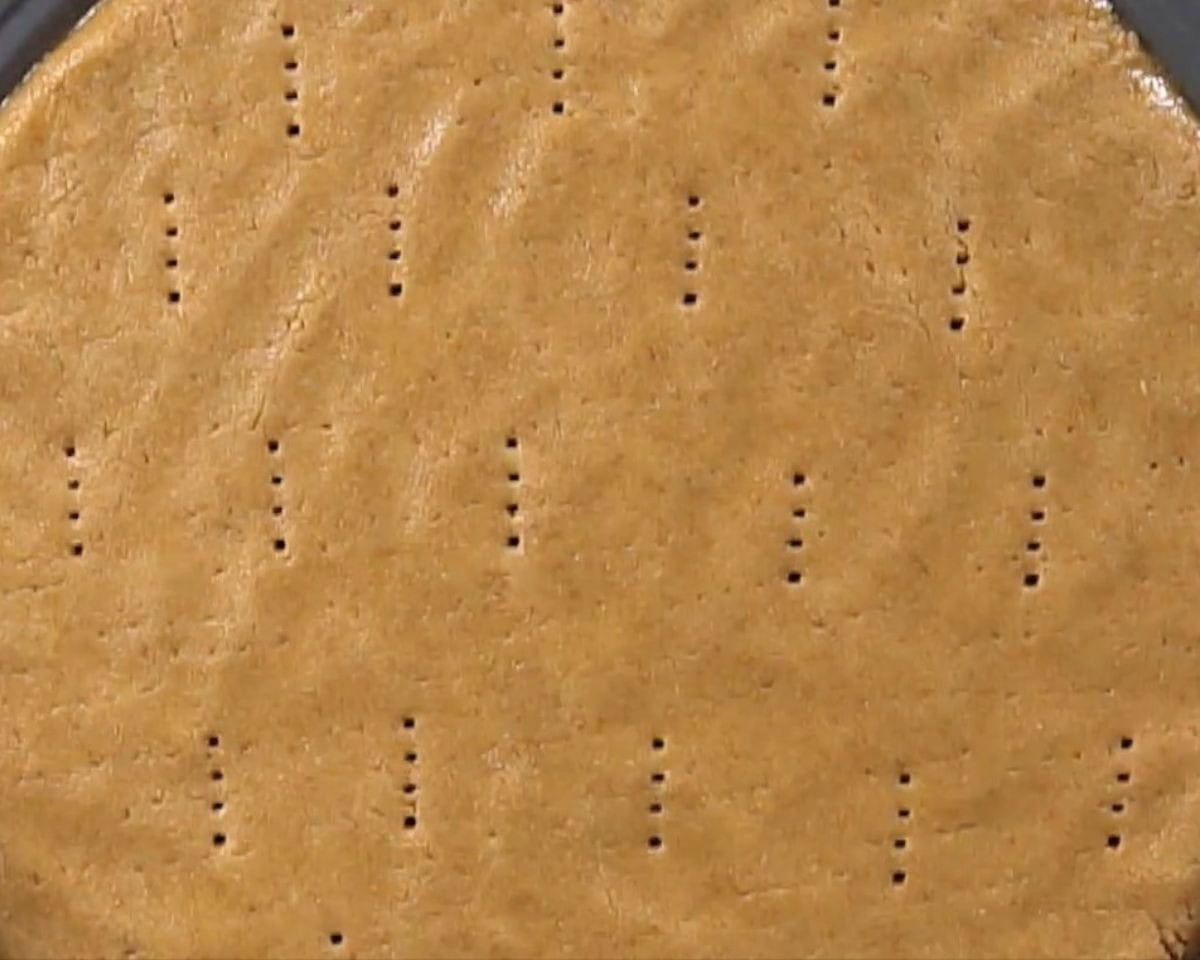 Poking holes in the crust.