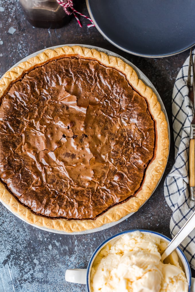 Brownie Pie is a rich, chocolaty dessert that's almost too good to be true! A homemade fudge brownie recipe baked straight into a pie crust gives you two desserts in one. Fudge brownie recipe baked into a pie crust