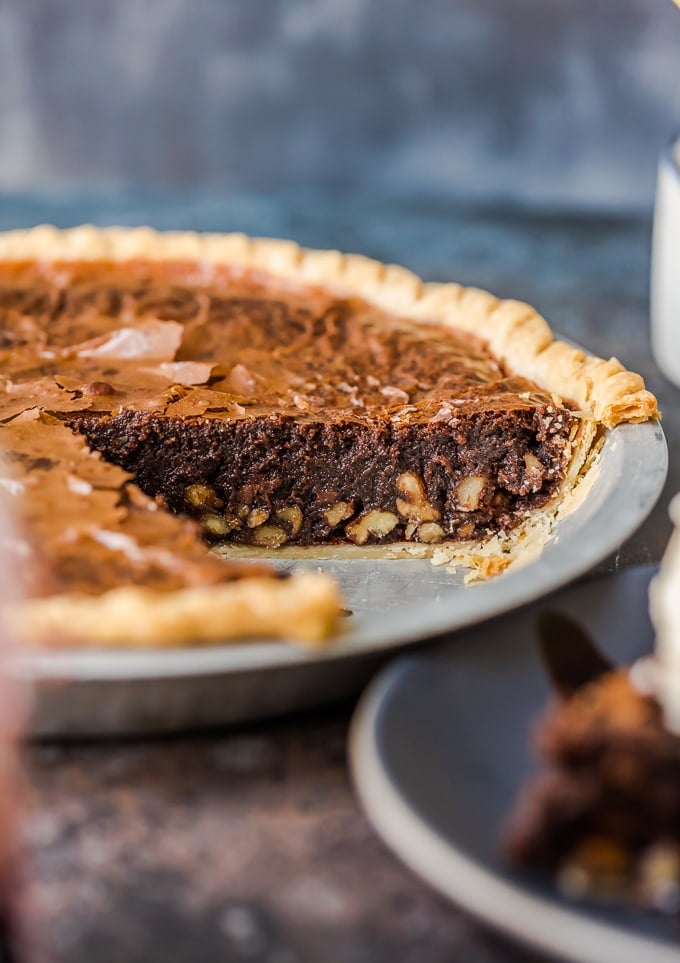 Brownie Pie is a rich, chocolaty dessert that's almost too good to be true! A homemade fudge brownie recipe baked straight into a pie crust gives you two desserts in one. Brownie pie with a layer of pecans inside