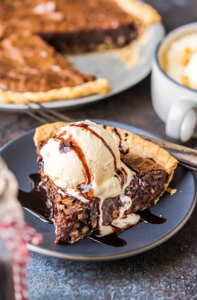 Brownie Pie is a rich, chocolaty dessert that's almost too good to be true! A homemade fudge brownie recipe baked straight into a pie crust gives you two desserts in one. A slice of brownie pie topped with vanilla ice cream and chocolate syrup