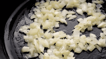 cooking chopped onions in a pan.