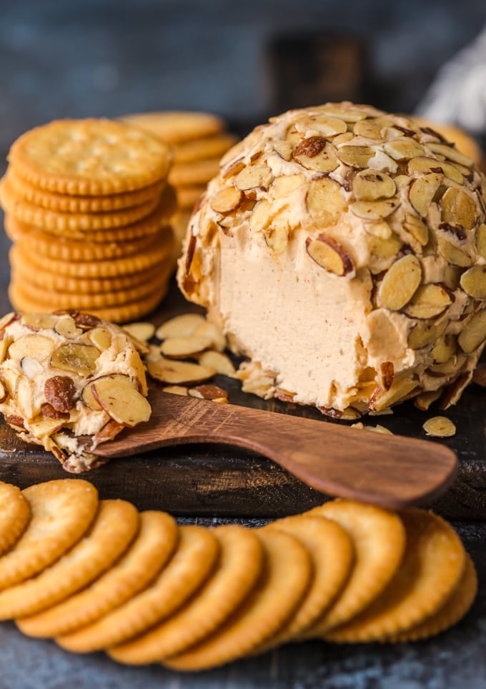 A classic cheese ball served with stacks of crackers