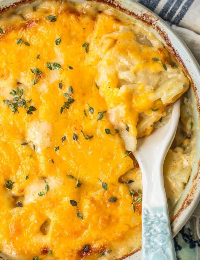 Cheesy Scalloped Potatoes are the perfect side dish for holidays. This easy cheesy scalloped potatoes recipe is creamy, delicious, and easy to make ahead of time!