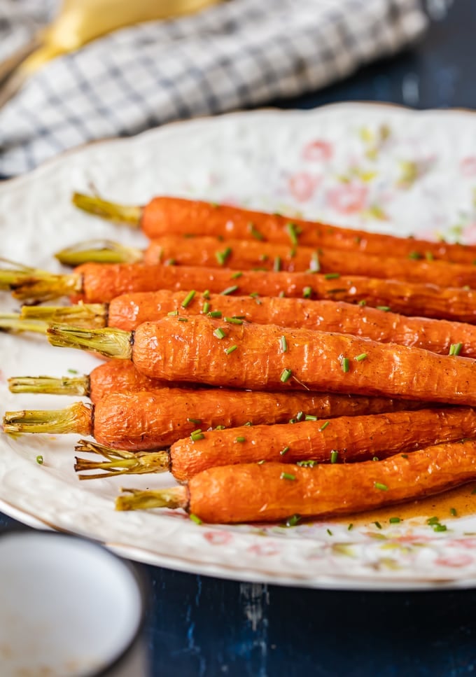 ginger carrots on a serving plate with glaze.