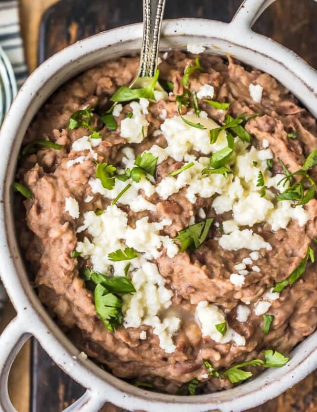 This homemade refried beans recipe is simple and absolutely delicious. Refried beans are the perfect side dish for your favorite Tex-Mex dishes, like tacos, cheesy chicken, nachos, burritos, & more!
