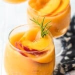 This Peach Frosé Recipe is a cocktail you definitely need for this hot Summer heat! All you need is frozen peaches, some Rosé wine, and a little honey. Frozen Rose is such a quick and easy fun cold drink to throw together for parties, friends and family, or just a quiet afternoon at home. We will show you how to make Frose and spice things up with this Peach Frose Recipe. So delicious, easy, fresh, and fun!