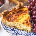 slice of quiche lorraine on a blue plate