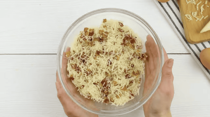 bacon and cheese in a glass bowl.