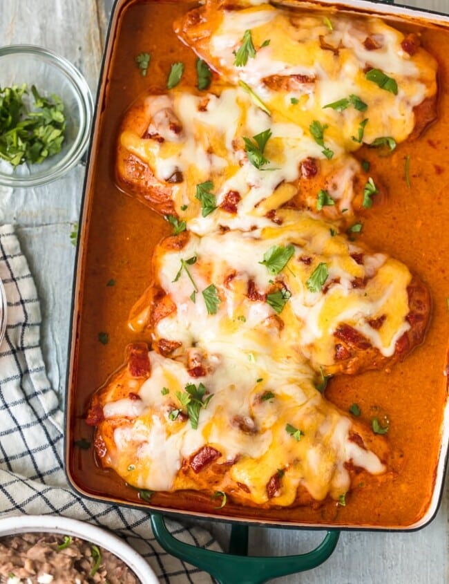 This Southwest Chicken Bake is so creamy, cheesy, & delicious. This easy Enchiladas Baked Chicken Breast recipe is perfect for dinner any night of the week!