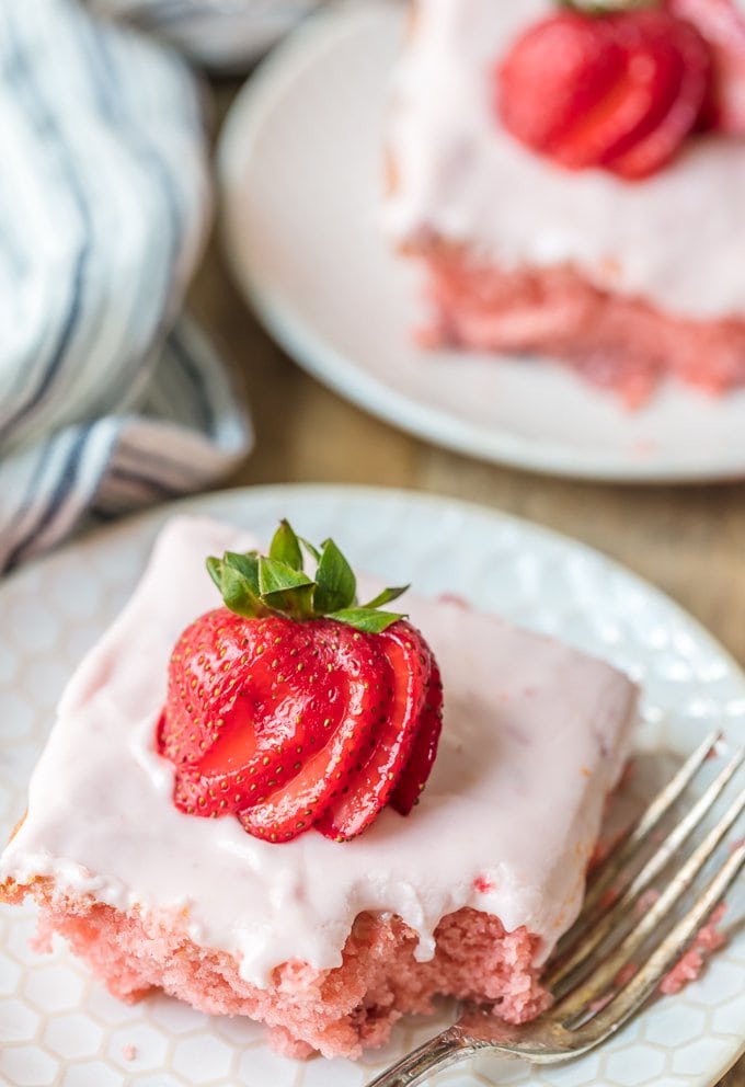 Homemade strawberry cake topped with fresh strawberries