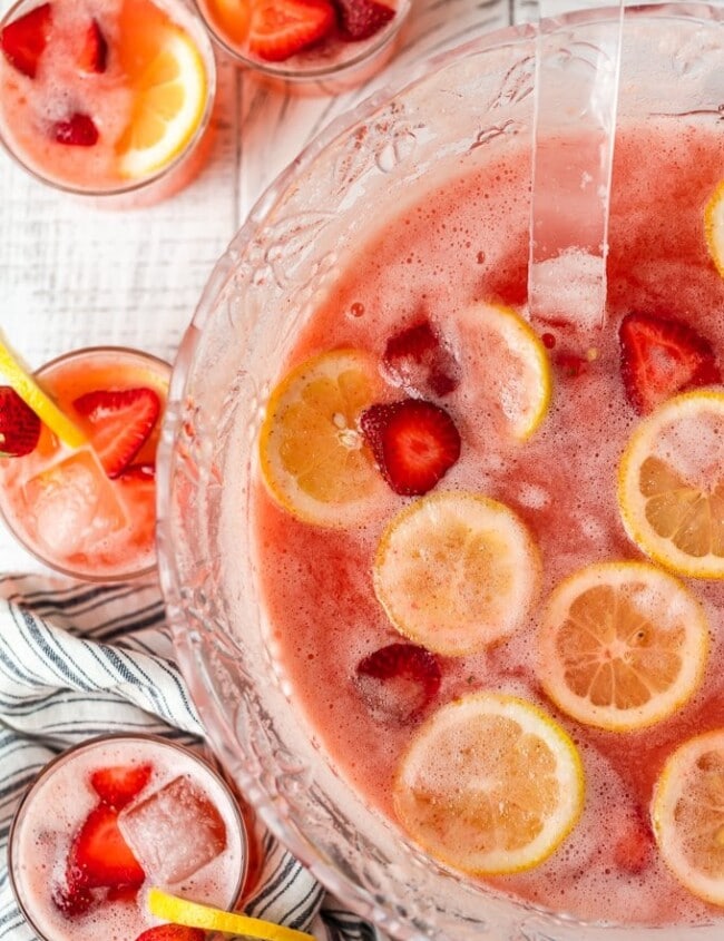 Strawberry Lemonade Party Punch is the best summer punch recipe! This refreshing drink is made with Everclear for the perfect party punch recipe.