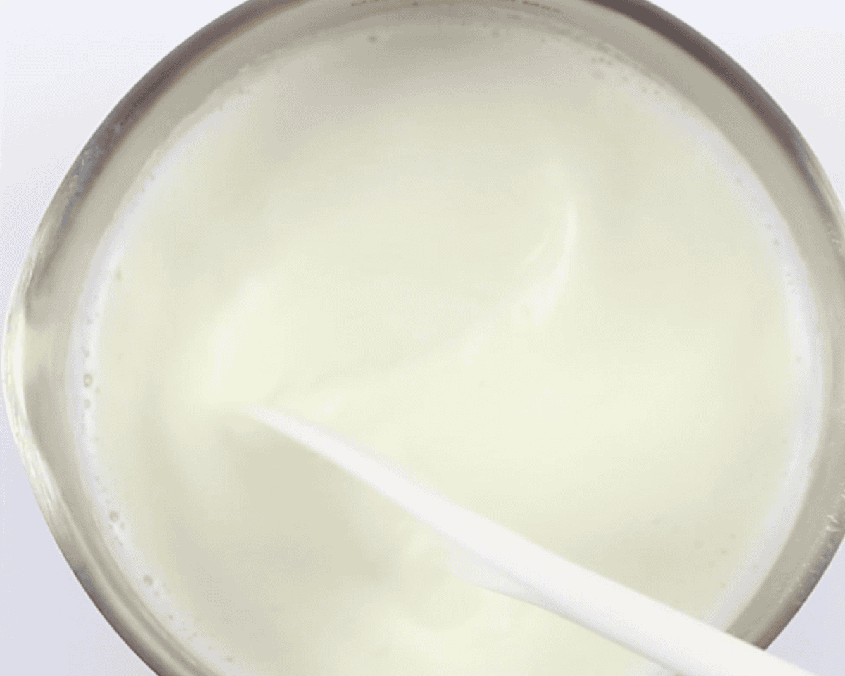 Boiling milk in a pan.
