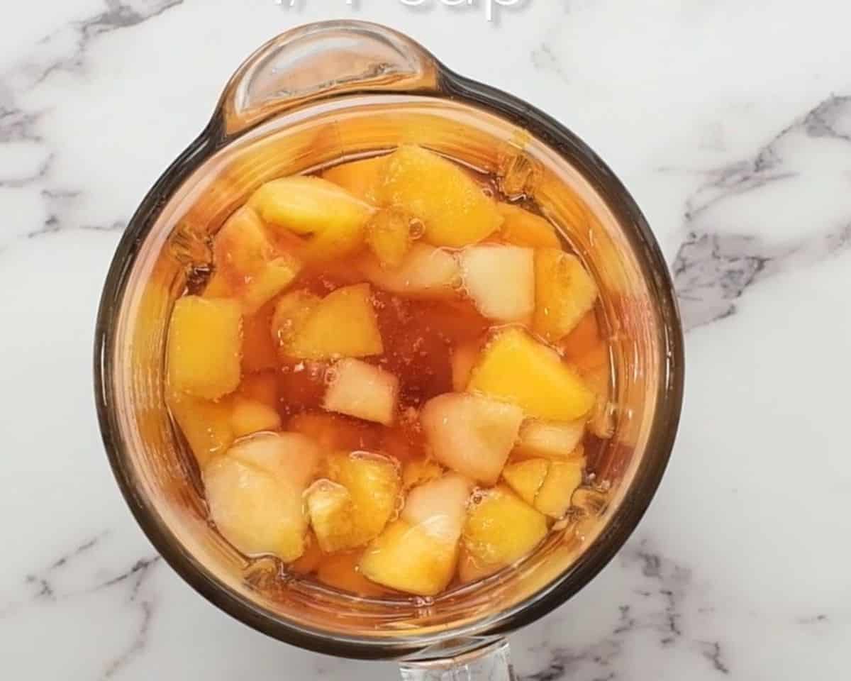 Peach frose ingredients in the blender.