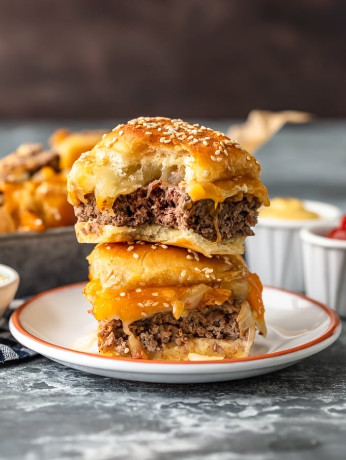 Baked Bacon Cheeseburger Sliders are a fun and easy lunch of dinner perfect for those busy school nights or fun game days! There's nothing better than this EASY Pull Apart Cheeseburger Slider Recipe for feeding a hungry crowd. So much cheese, so little time!