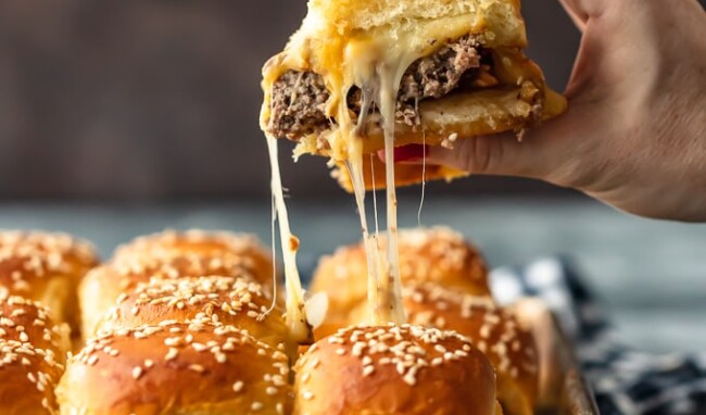 Baked Bacon Cheeseburger Sliders are a fun and easy lunch of dinner perfect for those busy school nights or fun game days! There's nothing better than this EASY Pull Apart Cheeseburger Slider Recipe for feeding a hungry crowd. So much cheese, so little time!