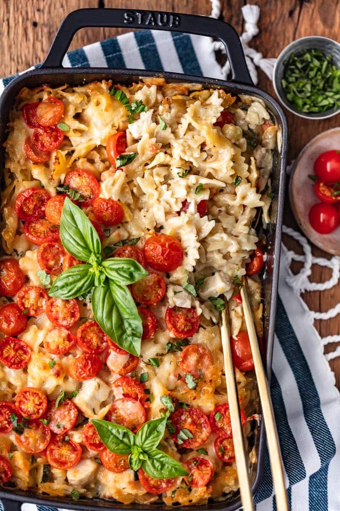 Chicken Alfredo Pasta Bake topped with cherry tomatoes and basil