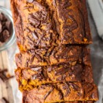 Pumpkin Chocolate Chip Bread is the perfect fall recipe. It's chocolatey, it's pumpkiny, and it's super delicious! This easy pumpkin bread recipe is simple enough to make any time you need a treat throughout the season, and it makes a fun holiday recipe too. This recipe for pumpkin bread with chocolate chips mixes everything I love about autumn!