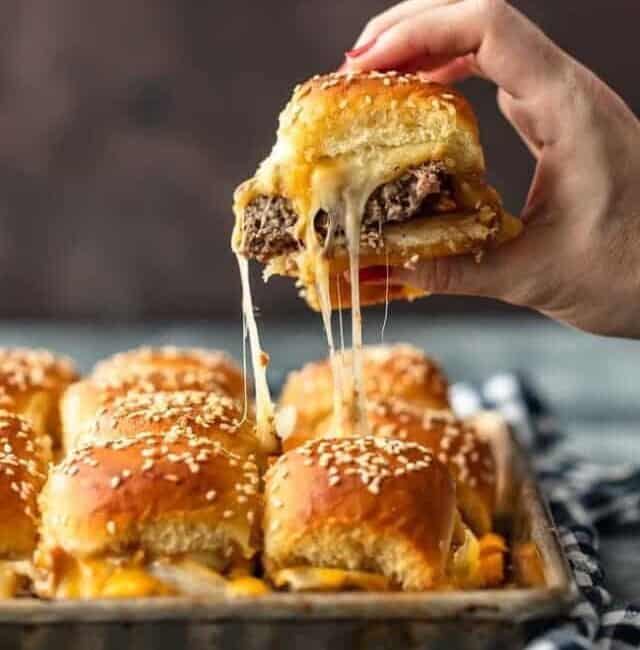 Baked Bacon Cheeseburger Sliders are a fun and easy lunch of dinner perfect for those busy school nights or fun game days! There's nothing better than this EASY Pull Apart Cheeseburger Slider Recipe for feeding a hungry crowd. So much cheese, so little time!