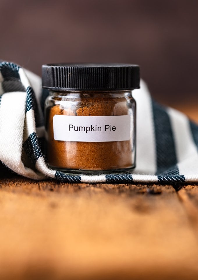 Homemade Pumpkin Pie Spice in a small glass spice jar