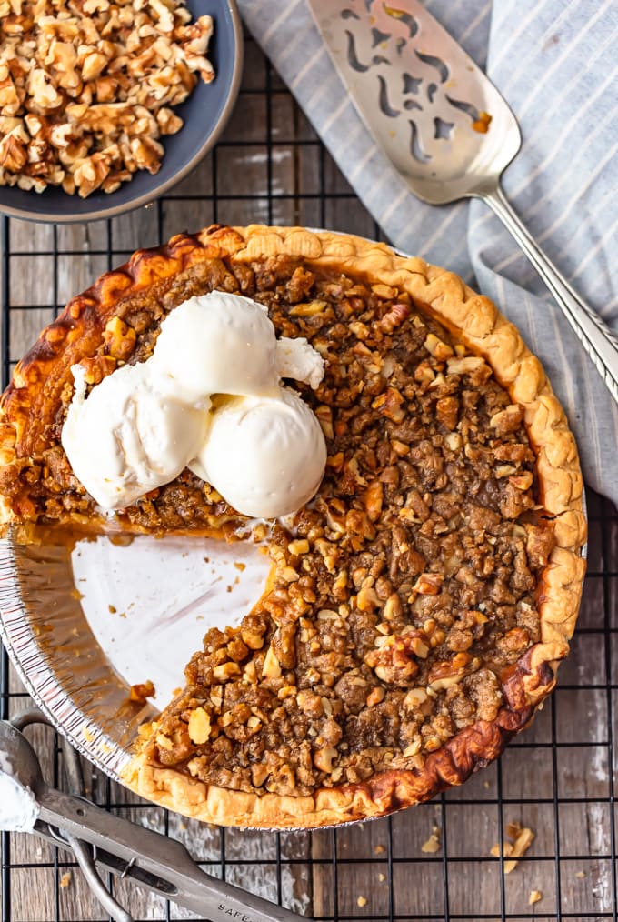 sweet potato pie topped with walnuts and cream