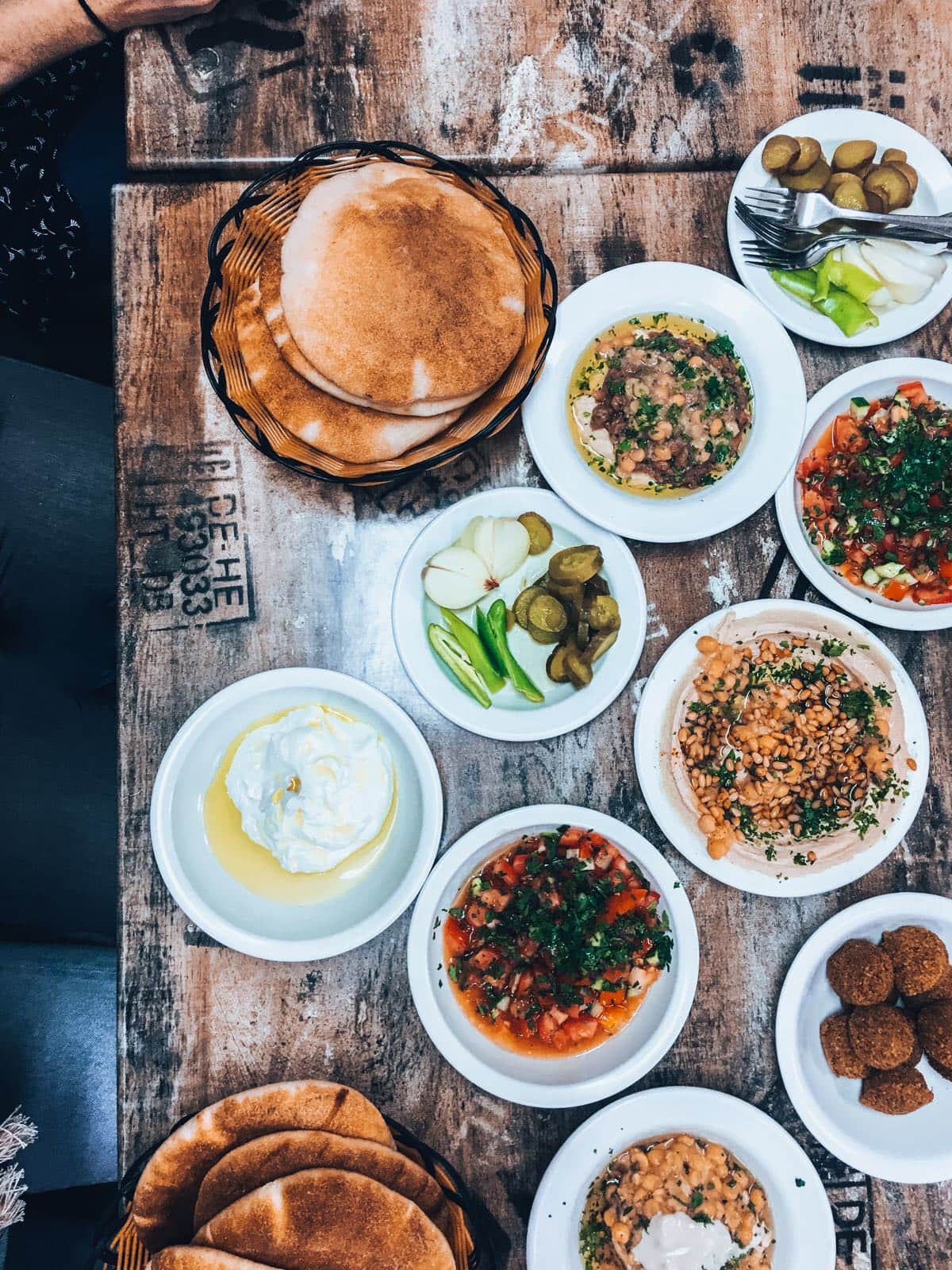 table of hummus, labna, and other dips in Israel