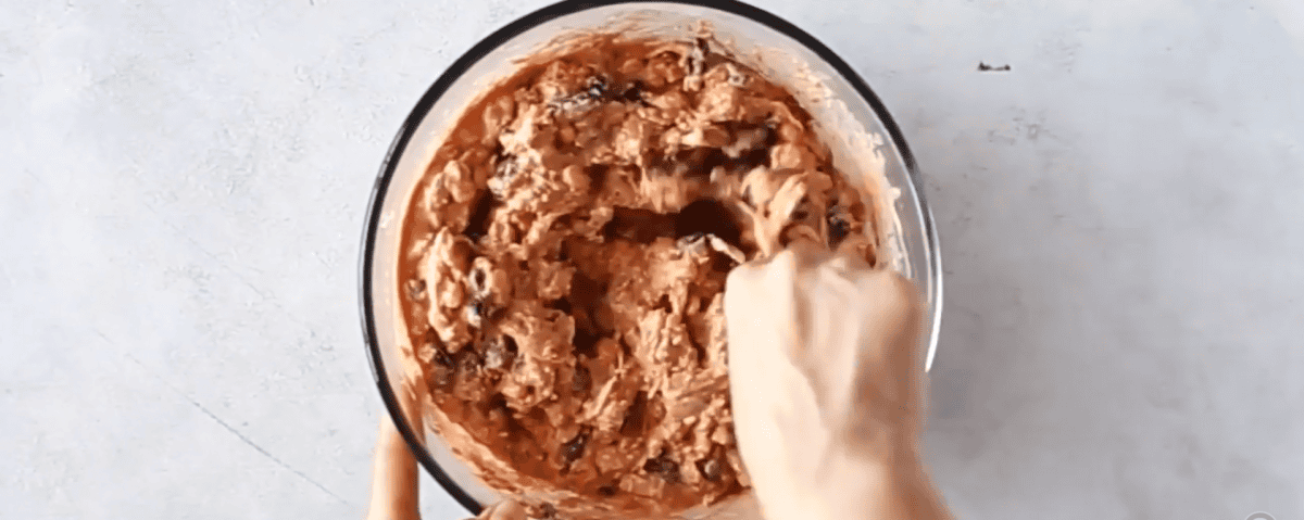adding chicken to the enchilada ingredients.
