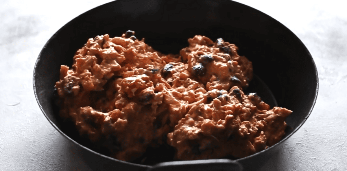 enchilada ingredients in an oven safe pan.