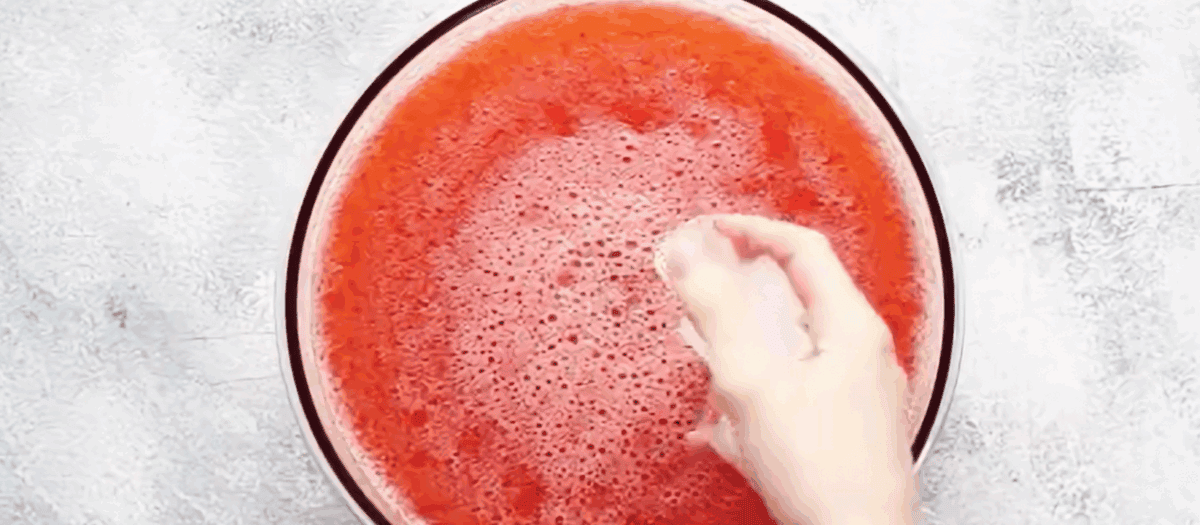 Strawberry lemonade punch in a glass bowl. 