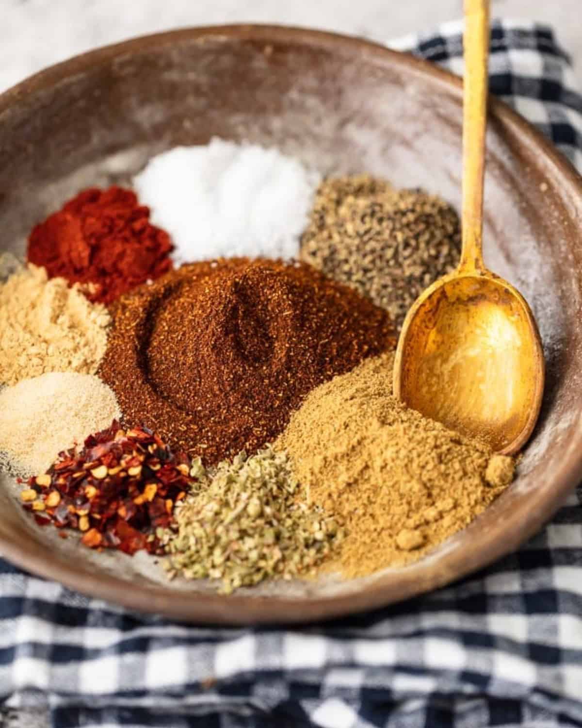 Homemade Taco Seasoning is an easy way to add some flavor to your recipes. This special blend of spices is just perfect for making tacos, casseroles, or any Mexican-inspired dish. Make your own taco seasoning in minutes, and keep it on hand for taco night or weeknight dinners! Spices for taco seasoning in a bowl.