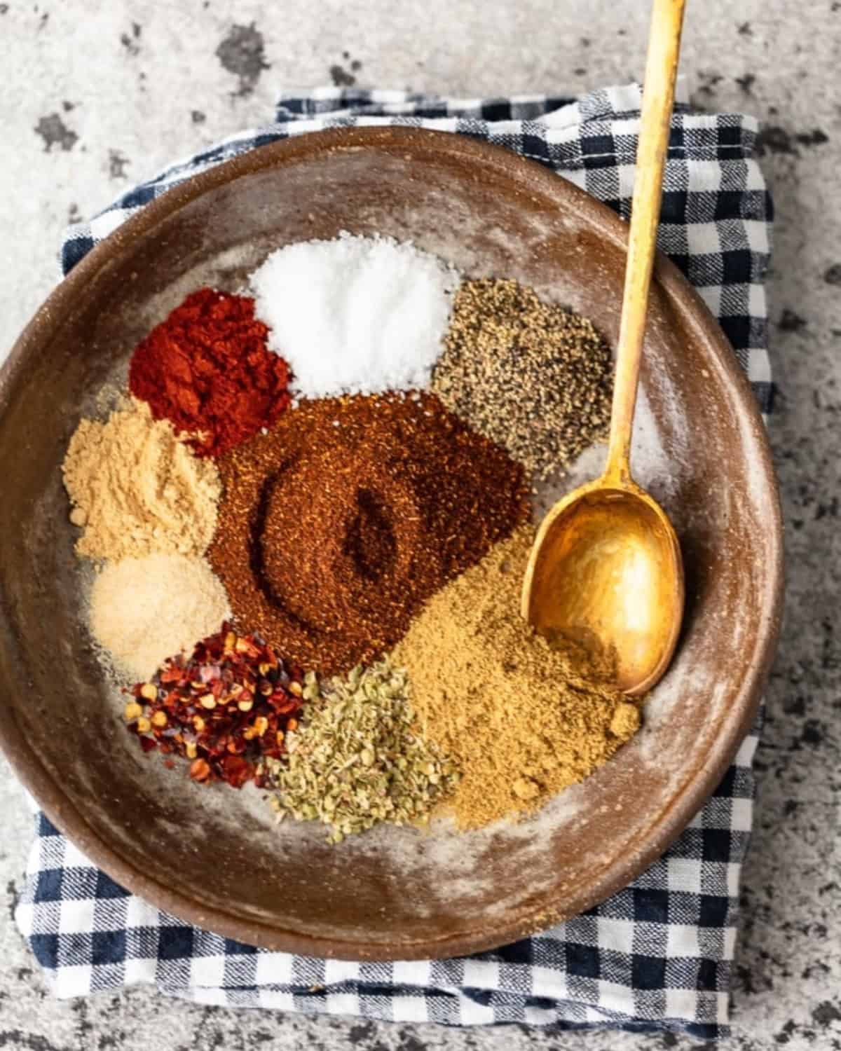 Homemade Taco Seasoning is an easy way to add some flavor to your recipes. This special blend of spices is just perfect for making tacos, casseroles, or any Mexican-inspired dish. Make your own taco seasoning in minutes, and keep it on hand for taco night or weeknight dinners! Spices for taco seasoning in a bowl.