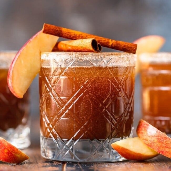 apple butter old fashioned in glass garnished with apple and cinnamon